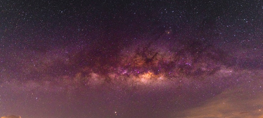 Wall Mural - night scenery with colorful and light yellow milky way full of stars in the sky in summer beautiful 