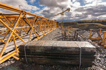 Wall Mural - Crane and scaffolding structures intended for the construction of a bridge in Spain