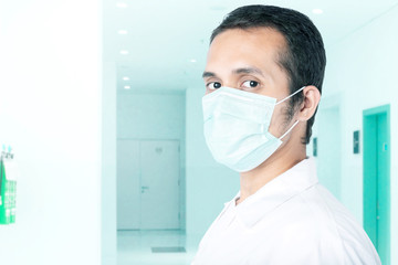 Asian man wearing a flu mask