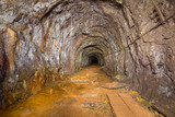 Fototapeta Desenie - Underground abandoned bauxite ore mine tunnel