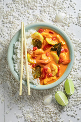 Wall Mural - Tasty red curry with coconut milk, kaffir leaves and shrimps