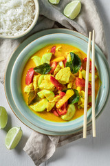 Wall Mural - Spicy yellow curry with chicken, vegetables and rice