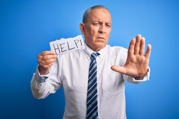 Sticker - Senior handsome businessman holding paper help message over isolated blue background with open hand doing stop sign with serious and confident expression, defense gesture