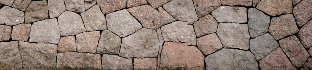 Poster - wall of granite boulders. panoramic shot. texture for design