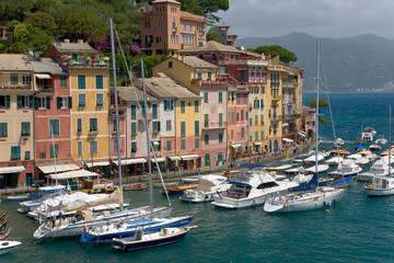 Wall Mural - View of Portofino's Riviera di Levante and it's colorful buildings and harbor, a small Italian fishing village in the province of Genoa on the Italian Riviera on the Mediterranean Sea, Italy, Europe