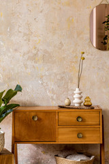 Wall Mural - retro composition of living room interior with wooden vintage commode, goldpink mirror, plant, ratta