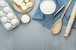 © Юлия Ромашко - Ingredients and kitchen utensils for making homemade cakes. Home kitchen. Copy space. Flat lay.