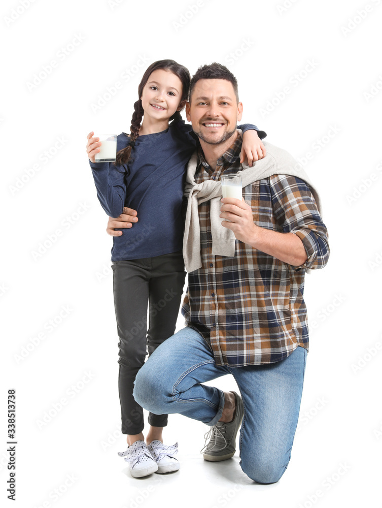 Father with daughter drinking milk on white background