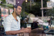 Portrait of handsome Turkish man relaxing at the coffee shop