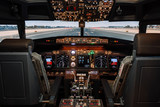 Fototapeta  - Full view of cockpit modern Boeing aircraft before take-off. Airplane is ready to fly. Landscape shot