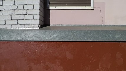 Wall Mural - background texture of the wall of the building with different elements, brick metal galvanized, red paint with stains, pink plaster, rollette swells