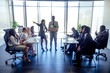 © yurakrasil - Dissatisfied senior korean boss scolding employees for bad work at diverse group meeting, result at office briefing modern panoramic window.afro man holding box with things and a potted plant