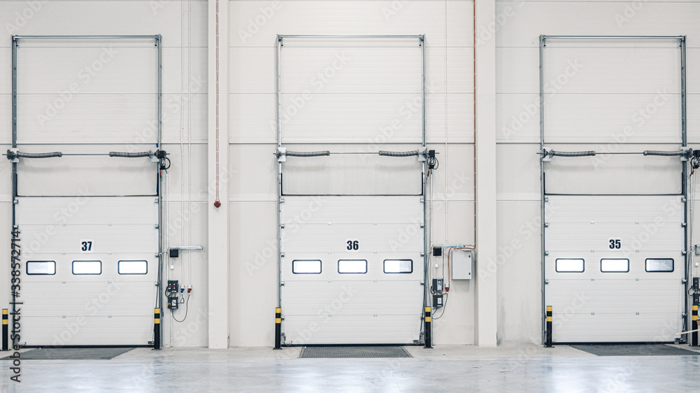 Loading Ramp Door Three loading ramp doors at distribution warehouse from inside Stock ...