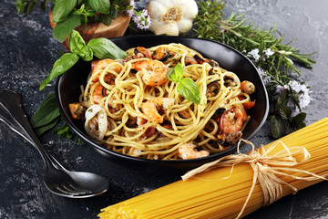 Wall Mural - Seafood pasta. Dish with mediterranean frutti di mare on table