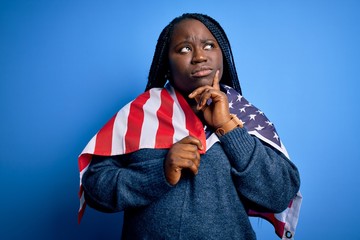 Sticker - Young patriotic african american plus size woman with braids wearing united states flag serious face thinking about question, very confused idea