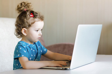 Distance learning online education. girl studying at home with laptop notebook  computer and doing school homework.