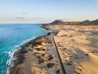 Aerial view of beautiful tropical beach and blue ocean landscape - heaven resort paradise concept for great sumer holiday vacation - tourism destination fuerteventura in spain canary islands