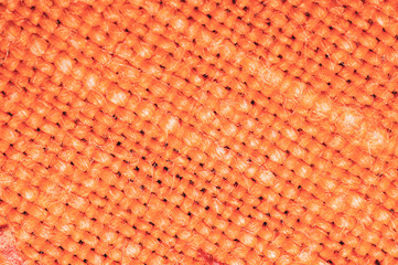 Orange fabric texture. knitted textile background. woven material macro