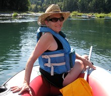 Portrait Of Happy Senior Woman White Water Rafting In River