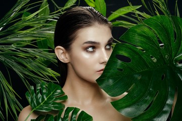 beautiful woman green leaves exotic