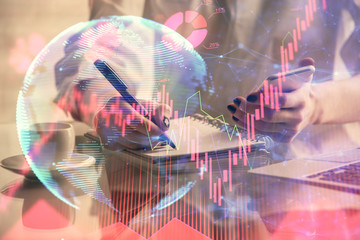 Double exposure of business theme sketch hologram and woman holding and using a mobile device.