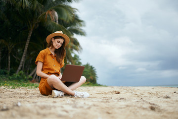 young woman sitting on the beach