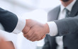 © ASDF - Two colleagues shaking hands after a business meeting