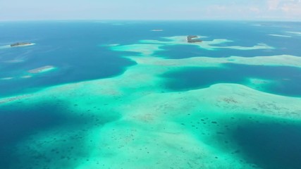 Wall Mural - Aerial: flying over exotic tropical island secluded destination away from it all, coral reef caribbean sea turquoise water white sand beach. Indonesia Sumatra Banyak islands.