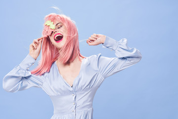 Wall Mural - young woman with blue eyes looking up