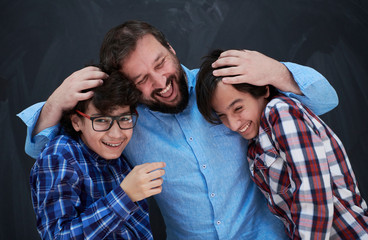 Wall Mural - happy father hugging sons