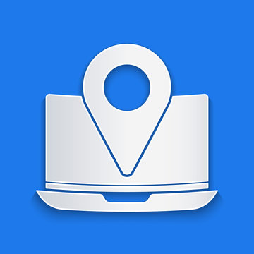 Paper cut Laptop with location marker icon isolated on blue background. Paper art style. Vector Illustration