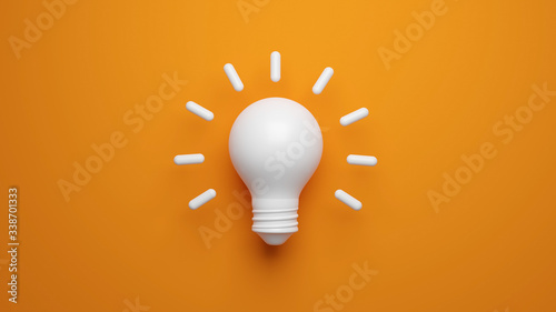 Cuadros en Lienzo Light bulb idea concept top view on orenge background