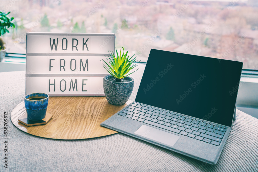 Working from home remote work inspirational social media lightbox message board next to laptop and coffee cup for COVID-19 quarantine closure of all businesses. - obrazy, fototapety, plakaty 