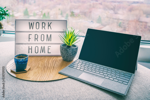 Cuadros en Lienzo Working from home remote work inspirational social media lightbox message board next to laptop and coffee cup for COVID-19 quarantine closure of all businesses