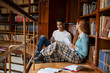 © Rido - Two university students studying at library