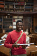 © Rido - University african student in library