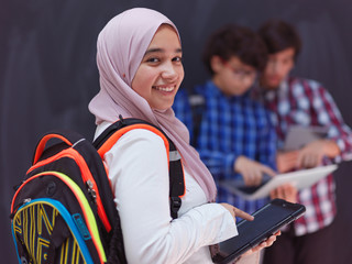 Wall Mural - Arab teenagers group working on laptop and tablet computer