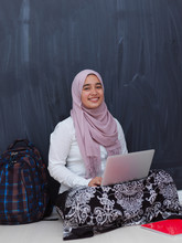 Arab Female Student Working On Laptop