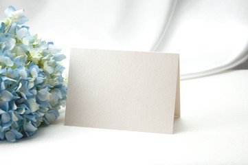 Mockup blank card, for Name place, Folded, greeting, invitation with Hydrangea flower on white background.