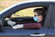 © sima - Protected teenage driver in car wearing mask and gloves, corona virus protection