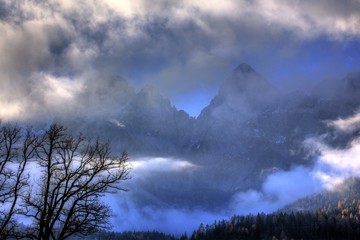 Sticker - High Alpine mountains rising through the clouds