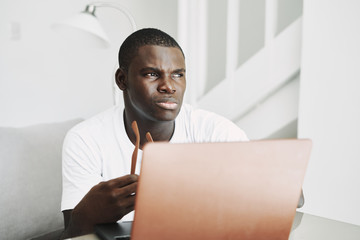 Poster - male of african appearance at home