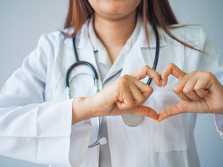 Wall Mural - Heart shape by hand of medical doctor