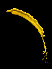 Wall Mural - yellow paint splash isolated on black background