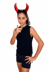 Studio shot of young beautiful teenage girl ready for Halloween pointing finger at camera