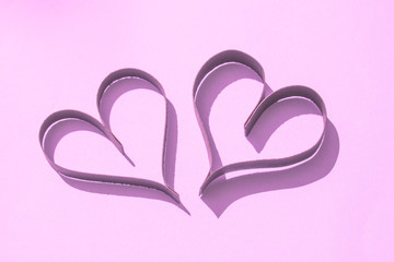 Pretty Pink Paper Hearts on Coloured background