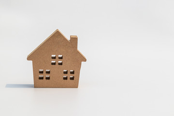 Wall Mural - Small wooden toy house on white background.