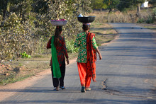 Two Girls Walking On The Street, An Indian Rural Scene.