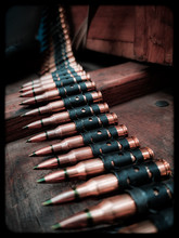 A Macro Close Up View Of A Row Of Regular Army Brass And Copper Bullets.