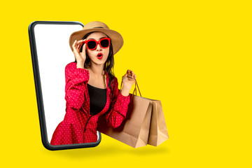 young attractive asian female holding shopping bag feeling excited, happy and amaze on beauty or fas